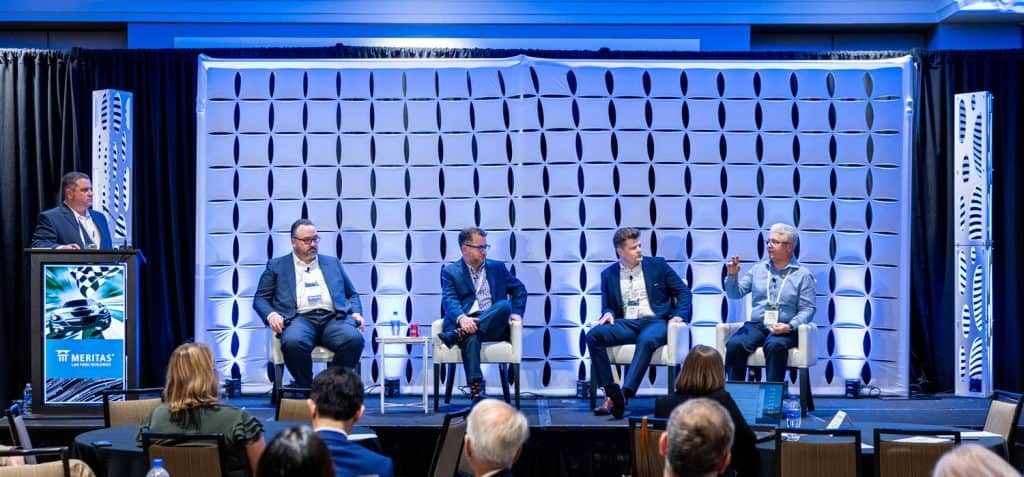 Corporate event photography at the Westin Charlotte showcasing panel discussion with keynote speakers.